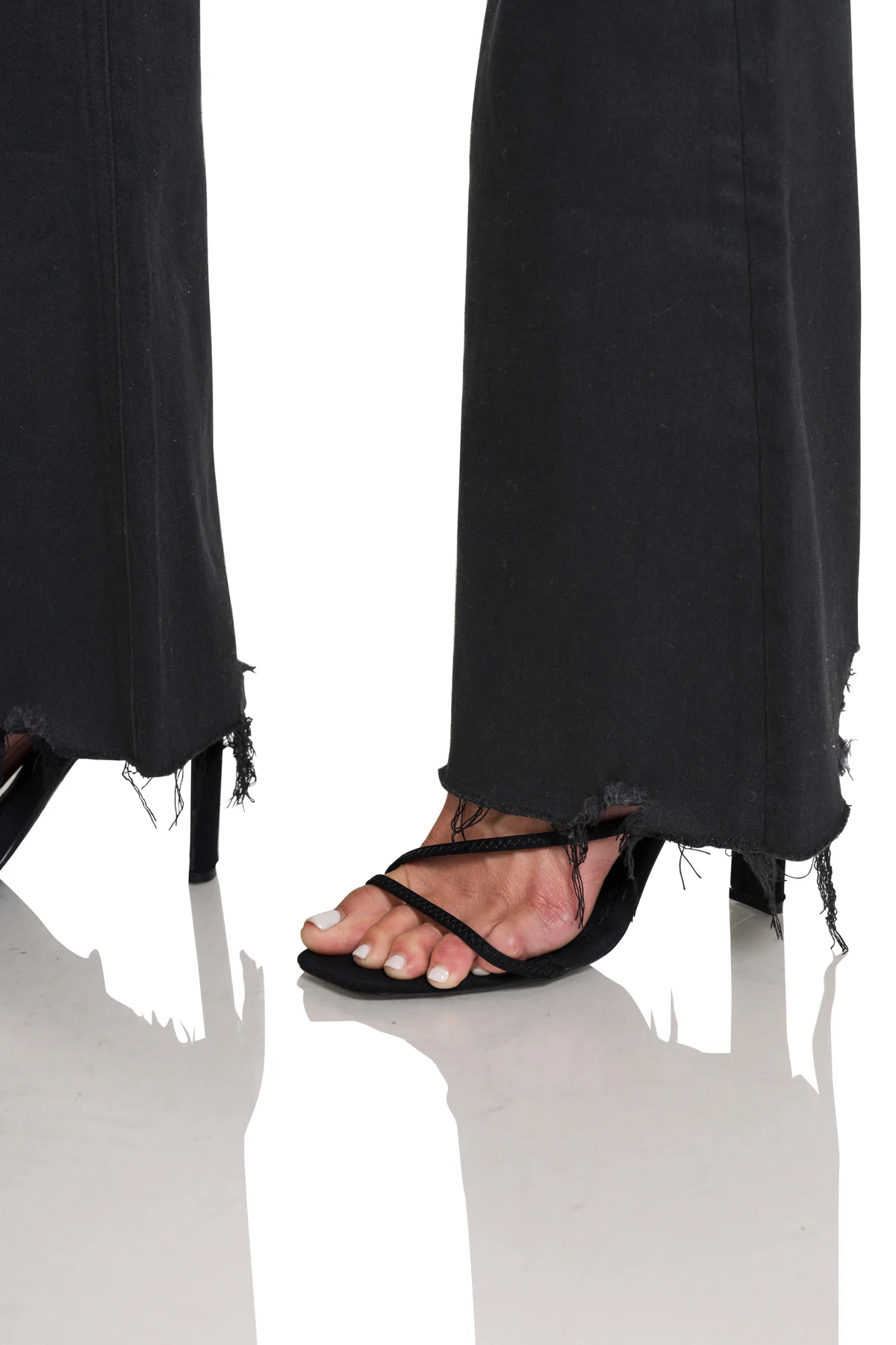 High-Rise Distressed Flare Jeans in Black